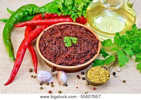 Adjika With Hot Pepper And Oil On Burlap