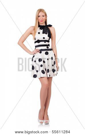 Tall model dressed in dress with polka dosts on white