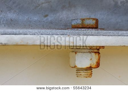 Old rusty bolts and steel nuts