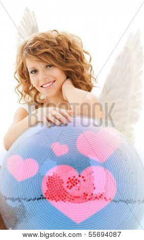 holidays, love and costumes concept - happy teenage angel girl with disco ball