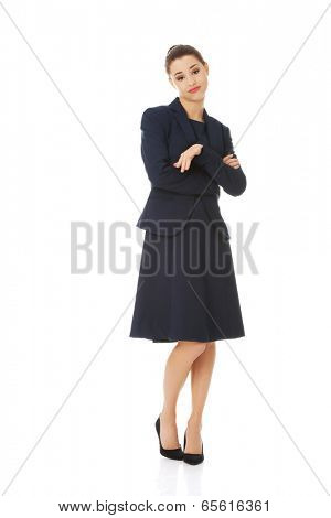 Anoyed and displeased businesswoman standing