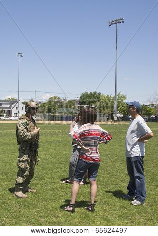 Unidentified US Navy from EOD team with spectators during Fleet Week 2014