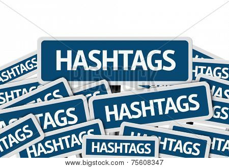 Hashtags written on multiple blue road sign