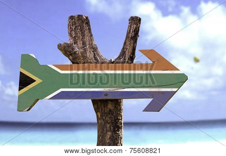 South Africa wooden sign with a beach on background 