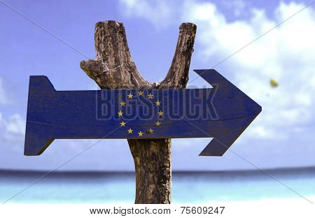 European Union wooden sign with a beach on background 