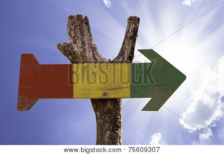 Guinea wooden sign on a beautiful day