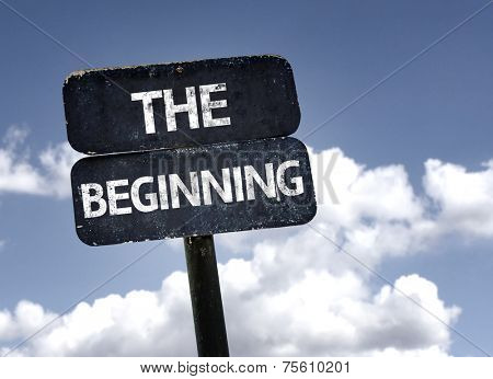 The Beginning sign with clouds and sky background 