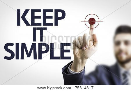 Business man pointing to transparent board with text: Keep It Simple