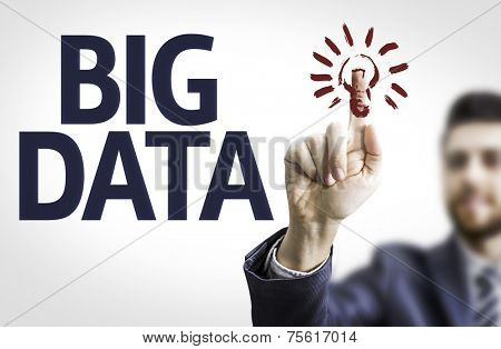 Business man pointing to transparent board with text: Big Data