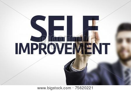 Business man pointing to transparent board with text: Self Improvement