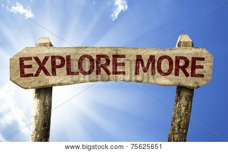 Explore More wooden sign on a summer day