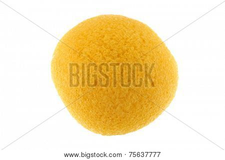 A round yellow natural facial Sponge made of vegetable fiber, Konjac, isolated on white