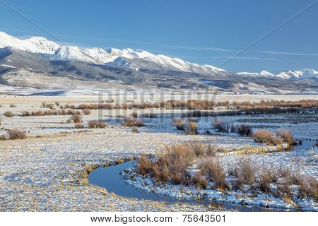 meanders of Canadian River and Medicine Bow Mountains in North Park near Walden, Colorado, late fall scenery