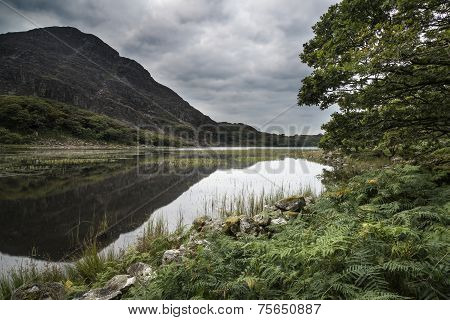 Landscape Image Of Mountain Reflected In Still Lake On Summer Morning