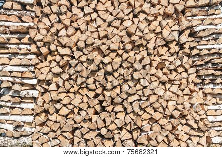 Stack Of Split Birch Firewood During Drying