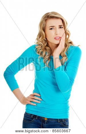 Beautiful woman having strong toothache.