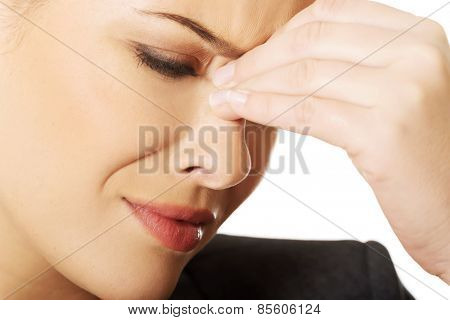 Young woman with sinus pressure pain