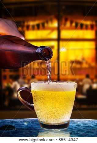 Lager Beer Drain From Bottle To Glass On Table With Beautiful Lighting Of Snack Bar Use For Alcohol