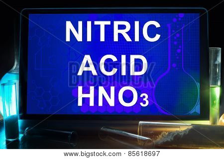 Tablet with chemical formula of  nitric acid.