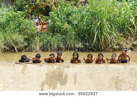 Asian Children Bath In The River