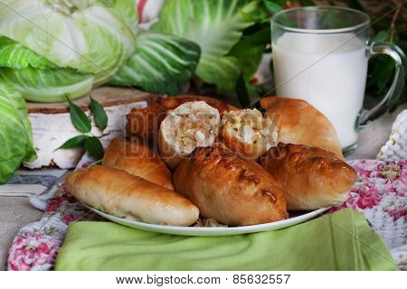 rustic still life with pies, cabbage and milk