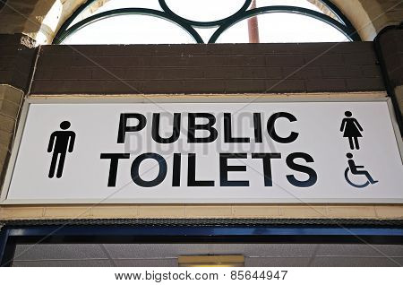 Public toilets sign.