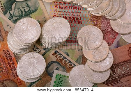 International currency and walking libery silver