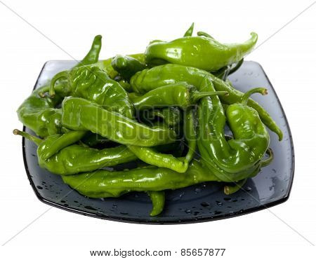 Wet Green Peppers On Glass Plate