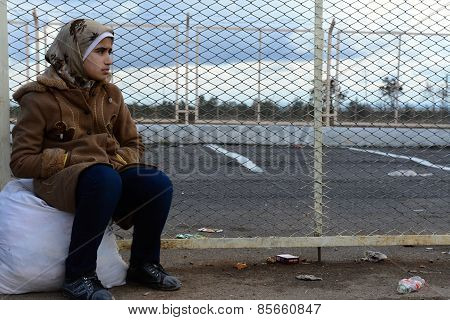 Sad young girl - refugee