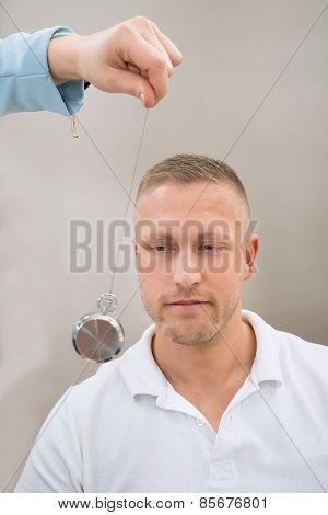 Psychiatrist Hypnotizing Patient With Pendulum