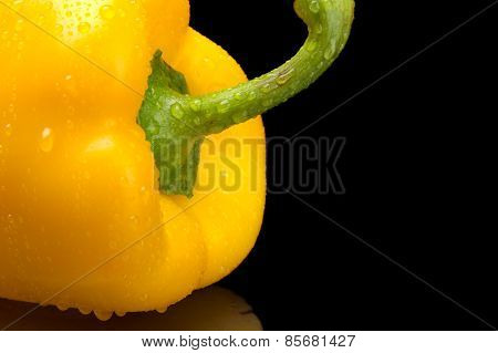 Cut Shot Of Yellow Bell Pepper Isolated On Black With Water Drop
