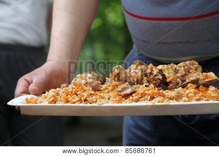 Hot rice pilaf on a tray