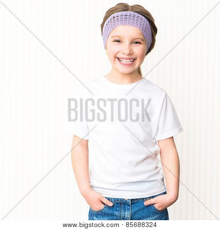 Cute smiling little girl in white t-shirt