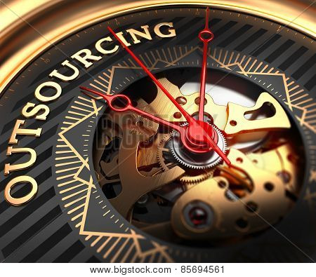 Outsourcing on Black-Golden Watch Face.