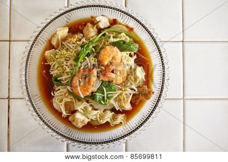 Lontong mie in Indonesian for its famous traditional food, or in English maybe spelled rice cake and noodle in vegetable soup