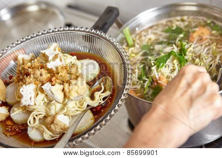 Lontong mie in Indonesian for its famous traditional food, or in English maybe spelled rice cake and noodle in vegetable soup