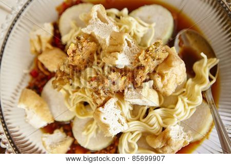 Lontong mie in Indonesian for its famous traditional food, or in English maybe spelled rice cake and noodle in vegetable soup