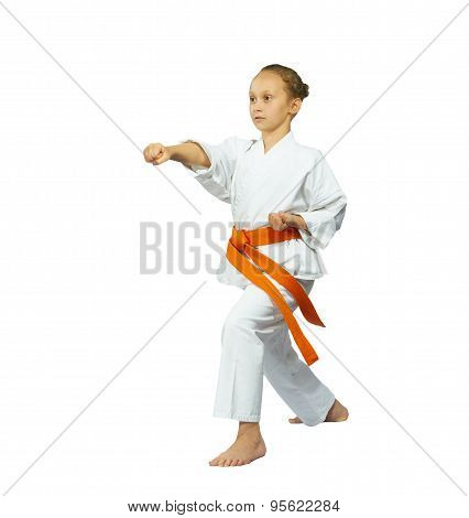 Sportswoman with an orange belt beat kick mae-geri