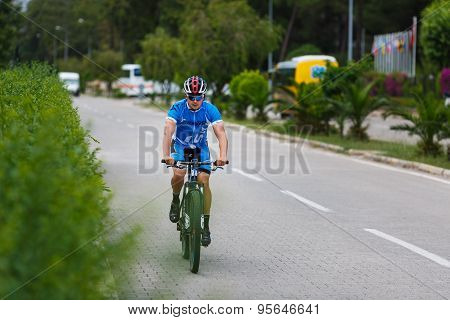 Lonely Cyclist Riding Bicycle