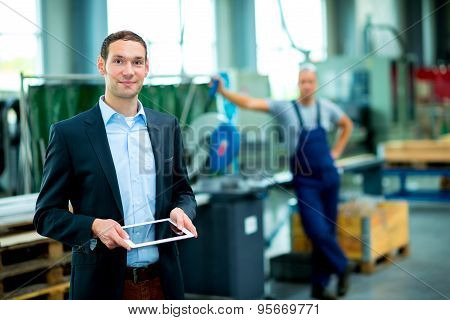 Young Boss In His Factory