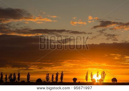 Beautiful Vibrant Sunset Over Field