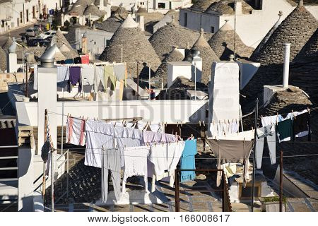 ALBEROBELLO, APULIA, ITALY - JANUARY 02, 2017 - Beautiful view of the traditional trulli houses with their conical roof