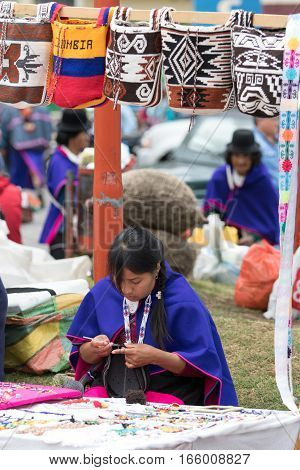September 6 2016 Silvia Colombia: an indigenous Guambiano woman selling gifts in the main plaza of the popular tourist town