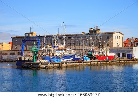 Fishing ships on the quay in port of Hel Poland.