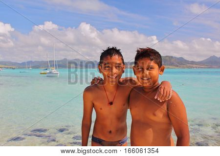 MAHEBOURG, MAURITIUS - NOVEMBER 8, 2012: Portrait of two local boys at Pointe d'Esny near Mahebourg
