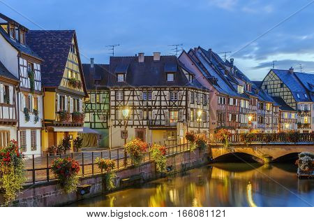 Embankment of Lauch River with historical houses in Colmar Alsace France. Evening