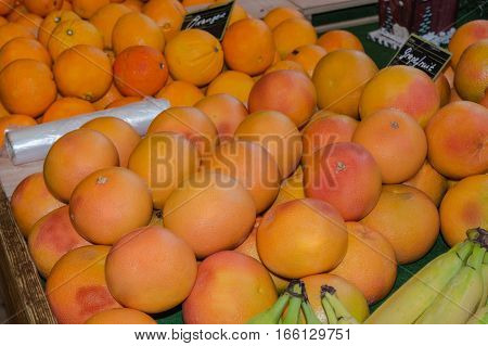 New Fresh oranges in a supermarket shelf.