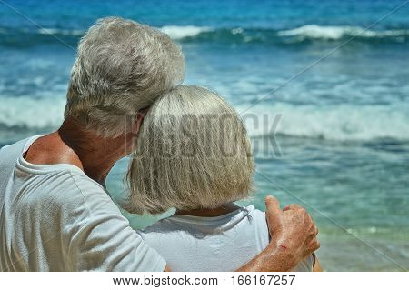 Happy elderly couple rest at tropical beac
