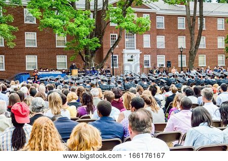 Charlottesville, USA - May 18, 2014: Crowd of people sitting on chairs listening to speaker at graduation ceremony at University of Virginia