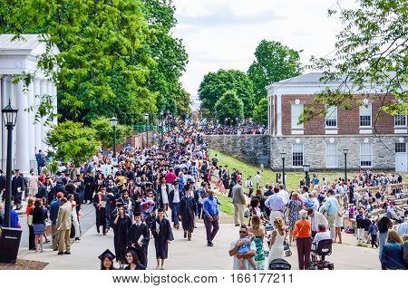 Charlottesville, USA - May 18, 2014: Crowd of people walking by amphitheater at graduation ceremony at University of Virginia